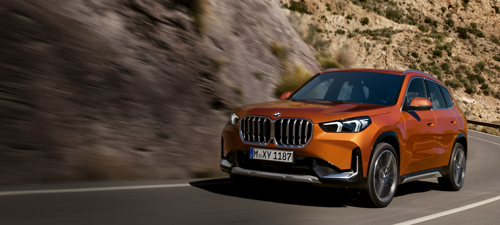 BMW X1 U11 xLine Utah orange metallic vue de trois quarts avant